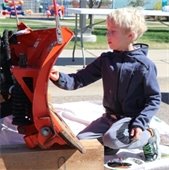 Boy painting plow